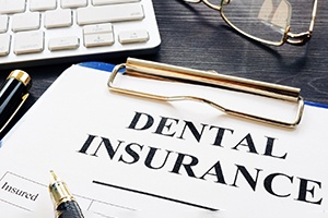 a dental insurance form on a table