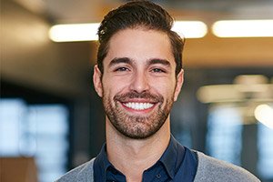 Man with attractive smile after dental bonding