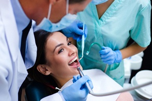 Woman smiling while getting dental crown in Palm Bay