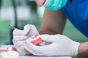 Closeup of dentist working on full denture