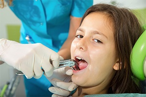 Young patient having tooth removed