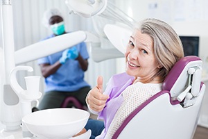 Older woman visiting implant dentist in Palm Bay