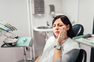 woman experiencing implant pain