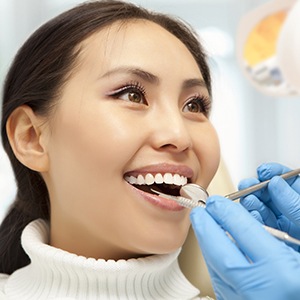 Woman receiving dental exam