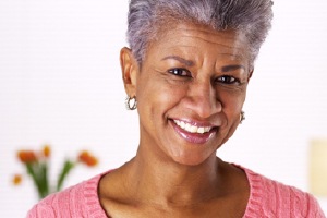 woman dental implant suppored denture smiling
