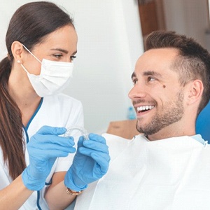 Man discussing ClearCorrect in Palm Bay with his dentist