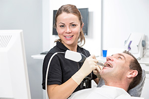 Hygienist with patient at a preventive dentistry appointment