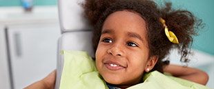 Young girl eagerly awaiting her children's dentistry visit