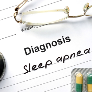 A doctor’s pad that says, “Diagnosis: Sleep apnea”