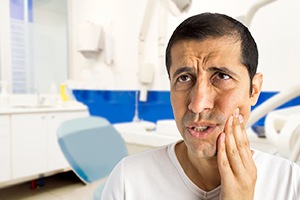 man with dental pain before emergency dentistry