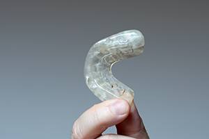 Hand holding occlusal splint