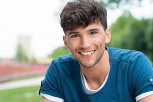 Man smiling after tooth colored filling restoration