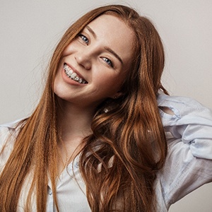 Young woman with traditional braces.