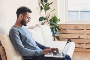 man looking at computer 