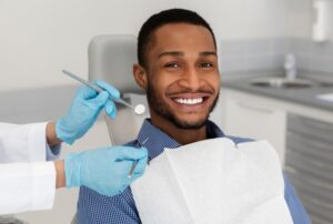 Man smiling before his routine checkup